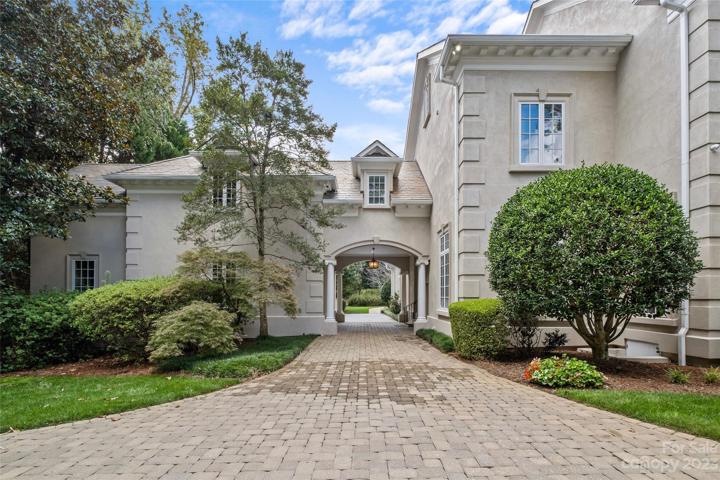 Porte-cochere leads you to the 3 car garage with ample parking.