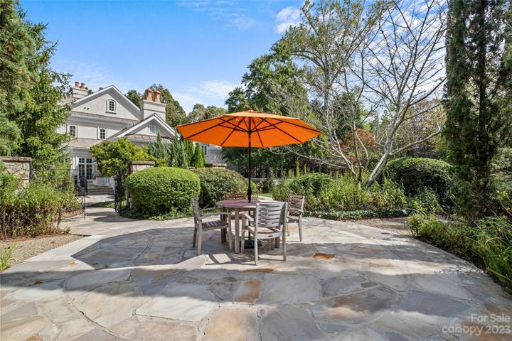 An entertainer's dream featuring incredible indoor/outdoor living spaces to enjoy all 4 seasons, resort pool with grotto spa, pool bath, outdoor fireplace, gardens with Charleston gates & many luxurious features throughout.