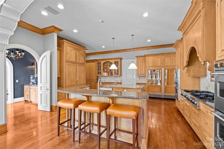 Gourmet chef's kitchen with Viking & SubZero appliances overlooking two-story great room.