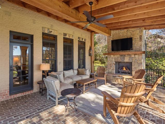 Covered porch with fireplace.