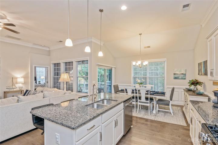 Kitchen area with wide plank laminate floor