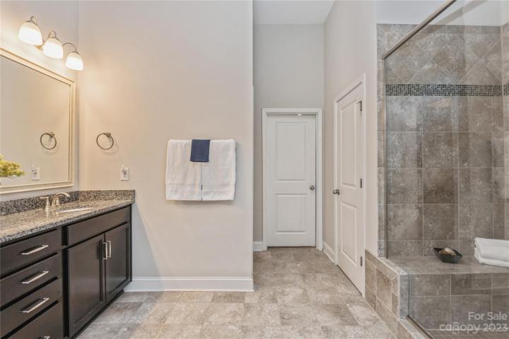 Primary Room Bath with ceramic tile and linen closet