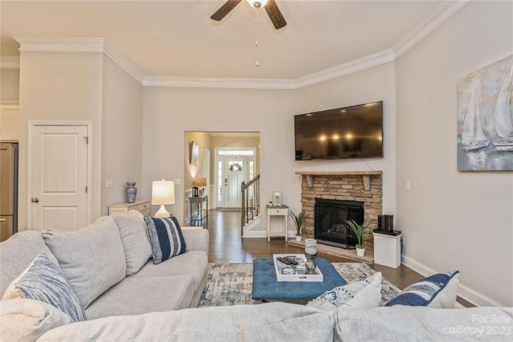 Living Room woth stacked stone gas fireplace and decorative mantle