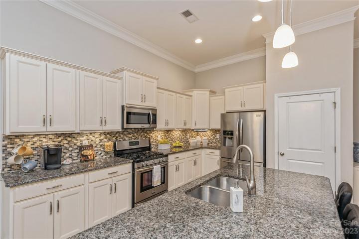 Kitchen with stainless steel appliances.