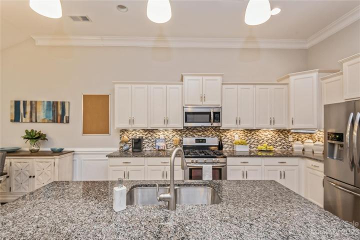 Kitchen with large Granite Island