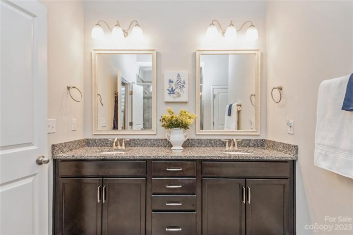 Primary Room Bath with granite counter tops and dual sinks