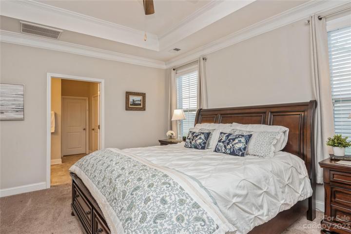 Primary Room with plush carpet and wqlk in closet