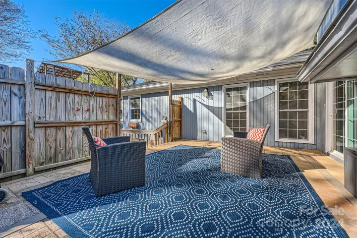 Sliding glass doors connect the outdoor deck area to the home, plus windows allow for plenty of natural light