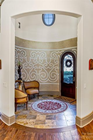 ...welcoming you into this magical 20 foot grand circular turret loft showcasing a majestic iron chandelier!