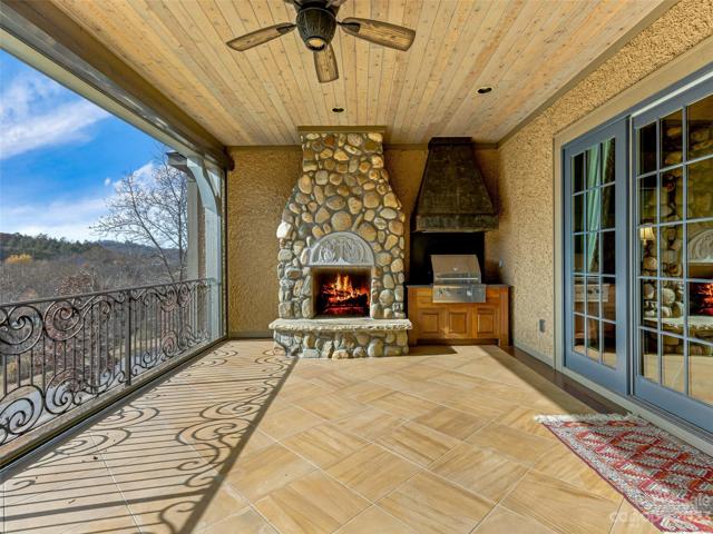 ...as well as this outdoor fireplace and built-in grill with hood!