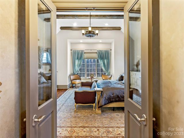 French doors on the main level invite your entrance to the Primary Suite
