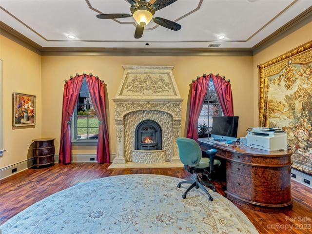 Your main floor home office (or library or studio or flex room) exudes a warmly rich interior