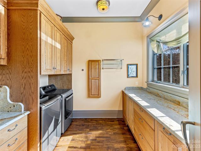 Convenience reigns in this main level laundry room - with Sunset Mountain views!