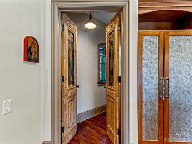 Your walk-in pantry with antique doors from New Orleans (right beside those unique custom doors on your kitchen's refrigerator/freezer)!