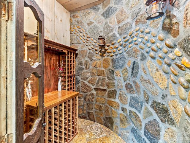This remarkable wine cellar has doors that previously graced an Old French Church from North Carolina!