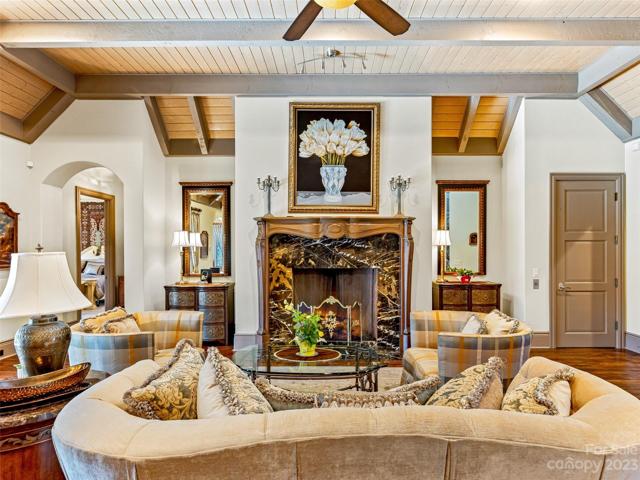 To the right of that gorgeous fireplace, is a door that leads to the convenience of an elevator
