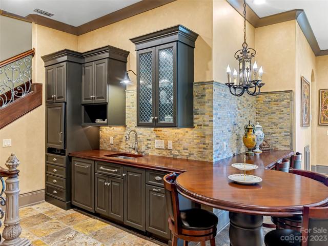 Back inside, this stunning wet bar invites camaraderie