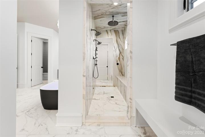 along with a walk-through steam shower complete the spa-like experience