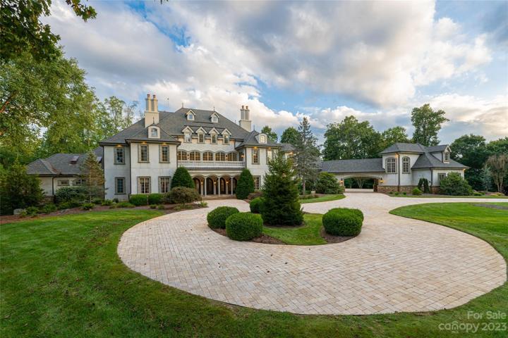 This European-inspired estate is set on just over 2.5 acres of beautifully landscaped level land at the pinnacle of Biltmore Park with year-round views!