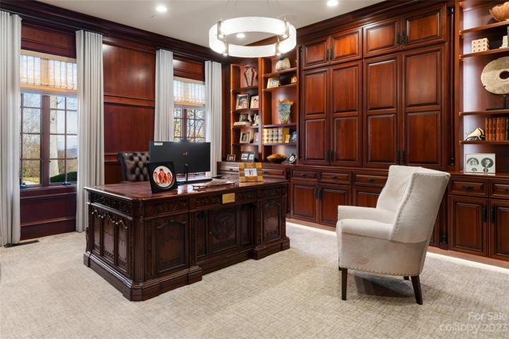 Handsome cherry wood-encased office/study on the main level