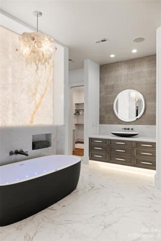 Heated marble floors and Balboa whirlpool tub...
