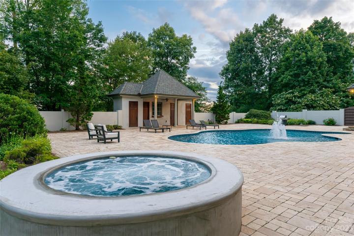 Private back yard oasis, complete with pool house and recently re-finished and tiled Hot tub and Pool