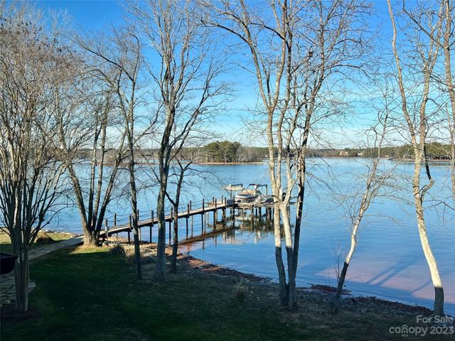 The private fixed pier & Dock with 10,000 lbs. capacity boat lift, SwiftShield cover & Jet ski lifts.