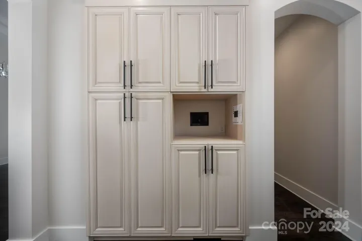 Pantry cabinets in hallway outside kitchen