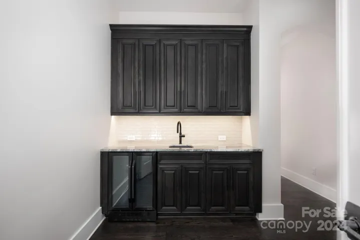 Morning bar in primary suite with quartz counter top