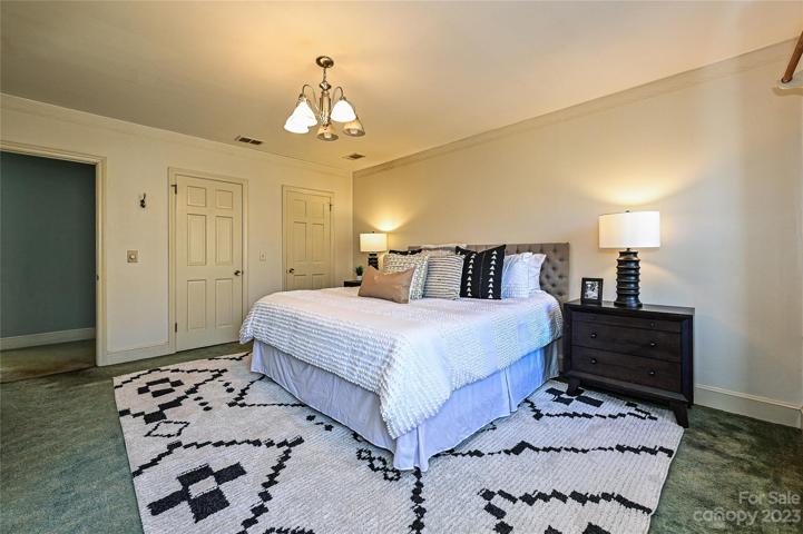 Primary bedroom with dual closets