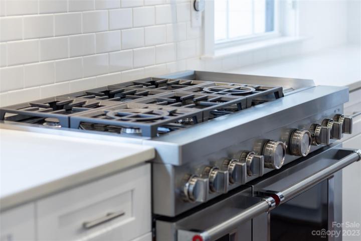 stainless steel 48" gas stovetop and ovens