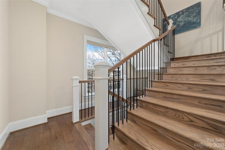 staircase with windows brining in lots of natural light