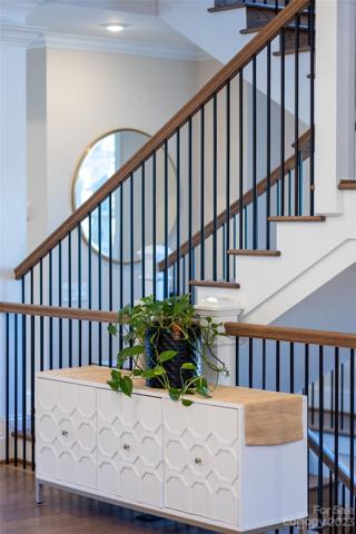Open and airy floor plan with lighting and staircase
