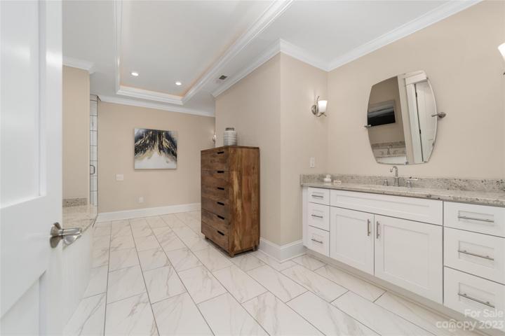 spacious bathroom with seperate sink areas