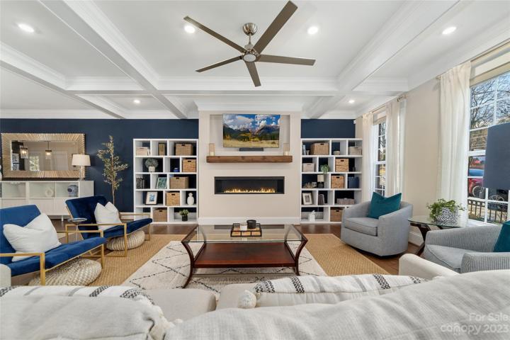 living room with fireplace for warmth and comofrt