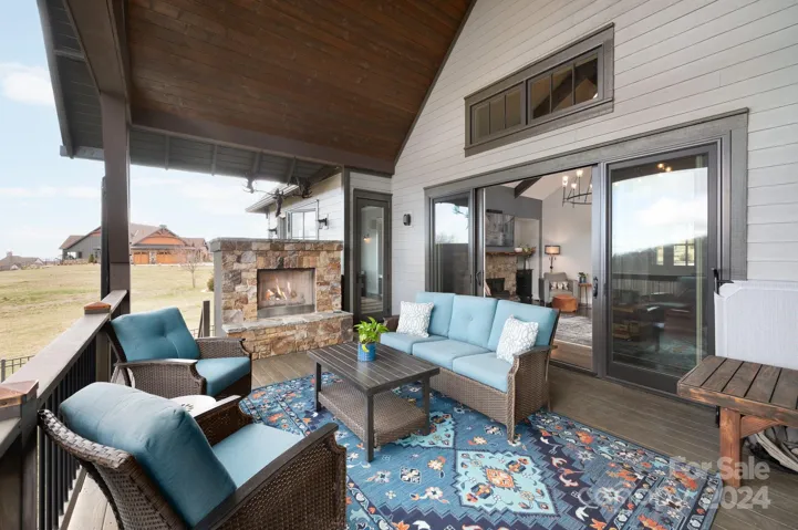 Back Covered Deck Features Long Range Mountain Views and a Stacked Stone Gas Fireplace