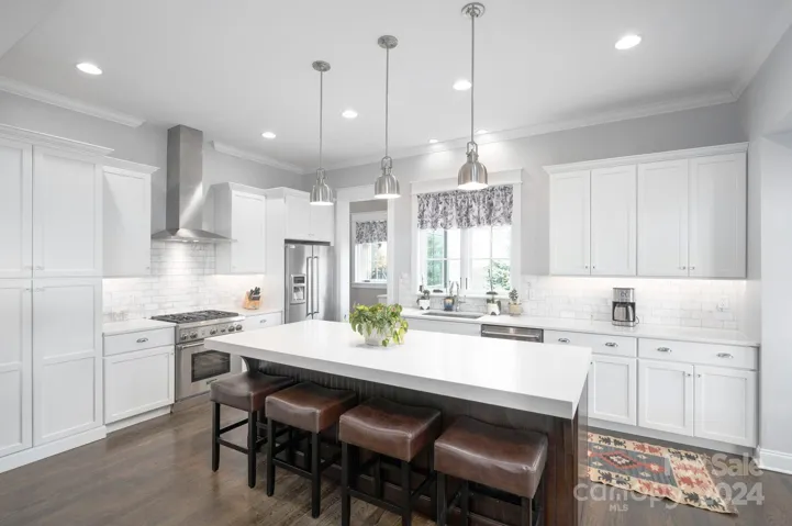 Quartz Countertops, Stainless French-Door Refrigerator, Dishwasher, and Six-Burner Gas Range (All Thermador)