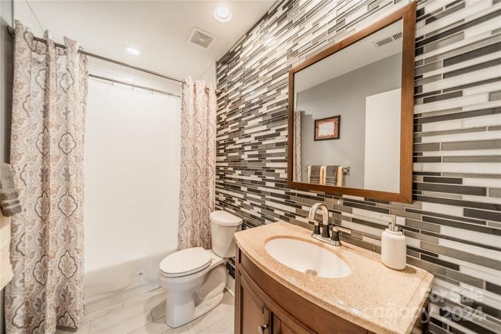 Secondary bath with porcelain tile.