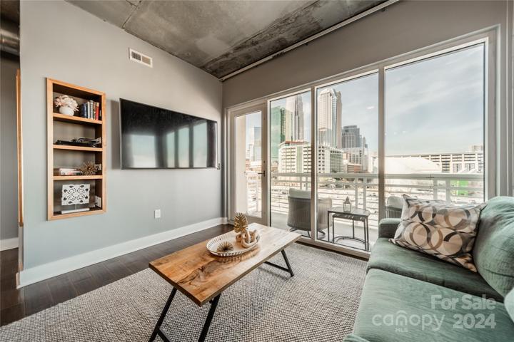 Open floor plan with floor to ceiling windows
