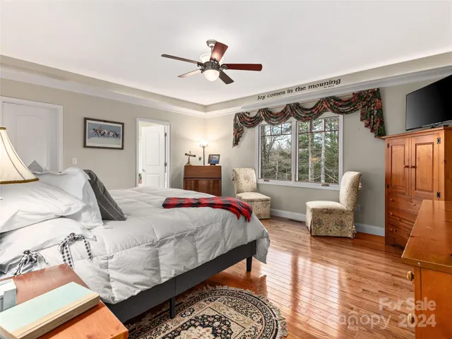 Primary bedroom with a great deal of space for your reading area, walk in closet, and spacious bathroom!