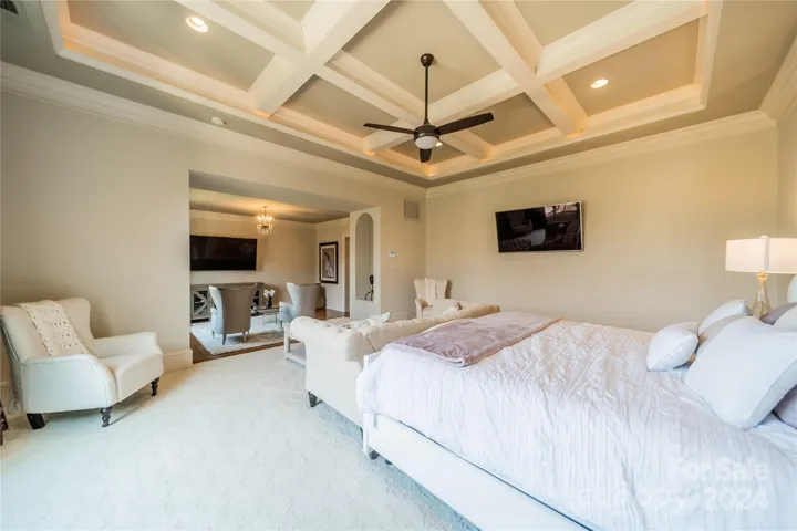 Primary suite features coffered ceiling