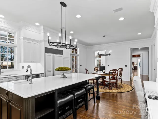 Quartz Island & Cabinet covered Sub Zero Refrigerator