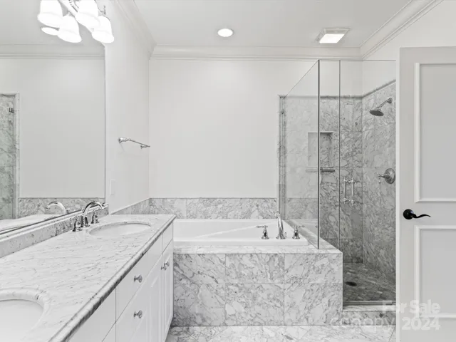 (4) 2nd Floor Primary Suite #2, marble vanity, tub and walk in shower.