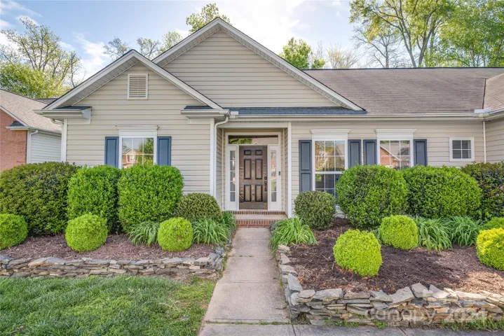 Lovely curb appeal and mature loandscaping greets you at 4794 Chesney Street in Concord