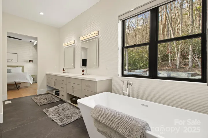 Primary suite full bath with soaking tub & large, walk-in tiled shower