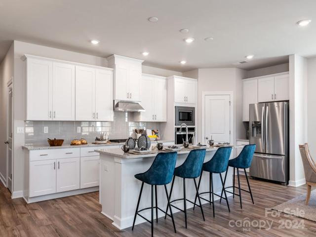 Photo is not of the actual home, but is an inspirational photo of builder’s model home and may depict options, furnishings, and/or decorator features that are not included