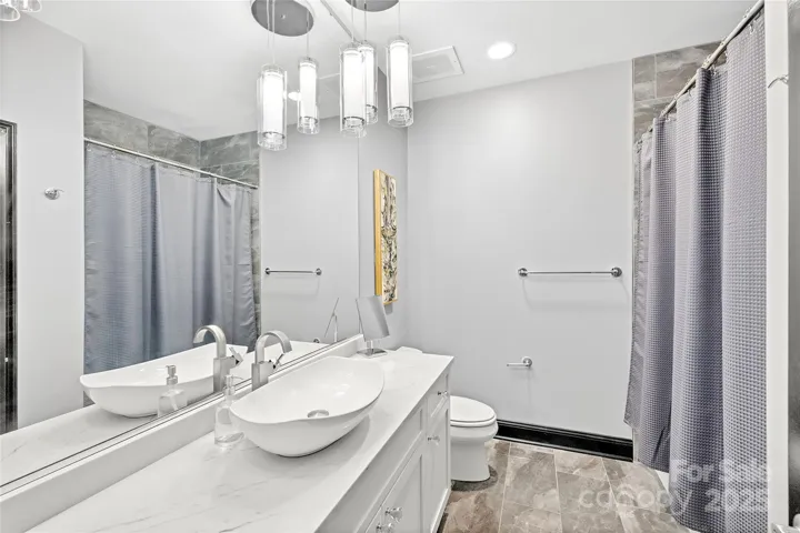 Ensuite bath for 2nd bedroom.