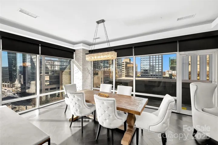 Dining area features dual exposure floor to ceiling windows.