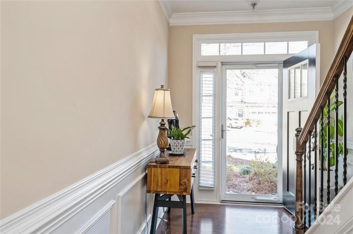 Foyer has lovely chair rail and picture molding
