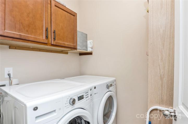 Laundry room with cabinets